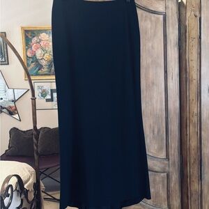 Elegant Emporio Armani straight maxi skirt with pleated back train.